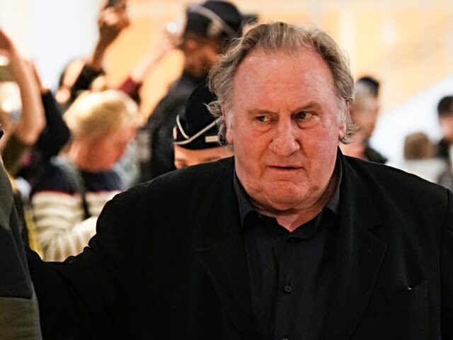 French actor Gerard Depardieu leaves during a suspension of hearing as part of his trial i