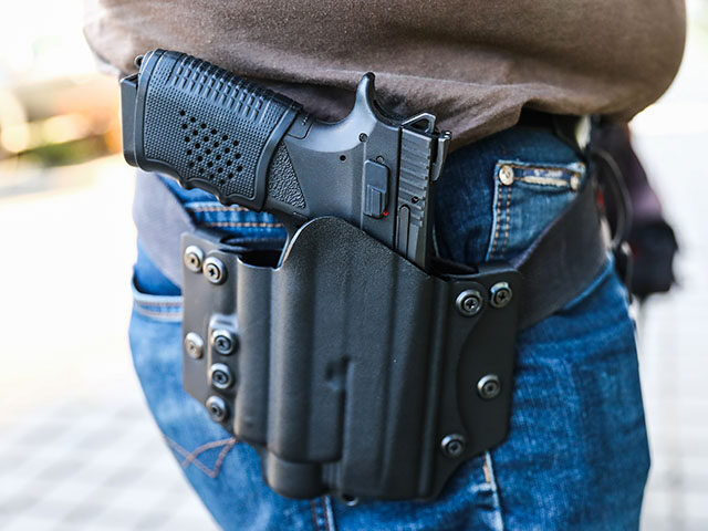 CZ P-09 handgun is seen in a holster in this illustration photo taken in Krakow, Poland on