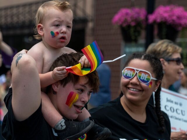 WILKES-BARRE, PENNSYLVANIA, UNITED STATES - 2022/06/26: A woman carries a baby with a Gay