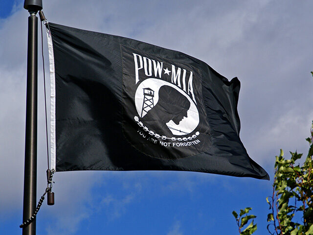 The official black and white POW-MIA flag unfurled above the VFW Cemetary in South Dakota.