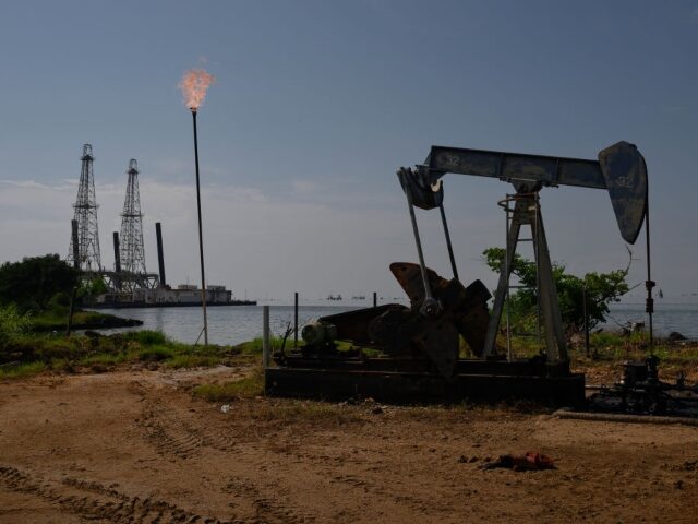A Petroleos de Venezuela SA (PDVSA) oil pumpjack on Lake Maracaibo in Cabimas, Zulia state