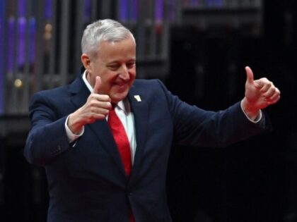 Republican National Committee Chairman Michael Whatley gestures as he walks on stage to sp