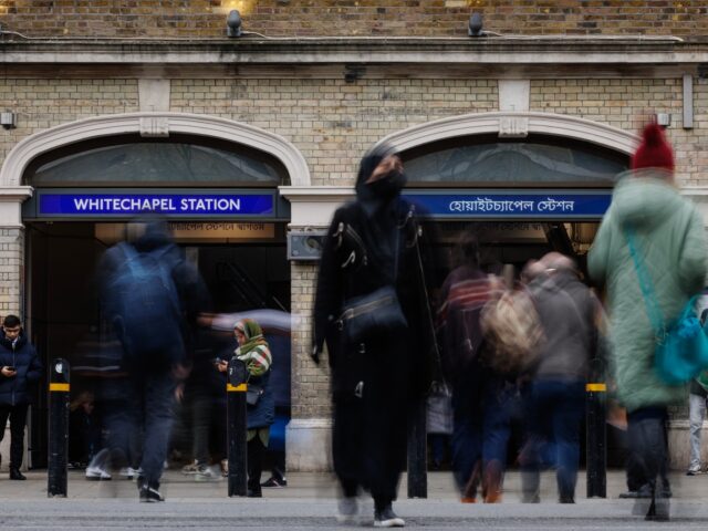 LONDON, ENGLAND - FEBRUARY 12: Members of the public outside Whitechapel Underground Stati