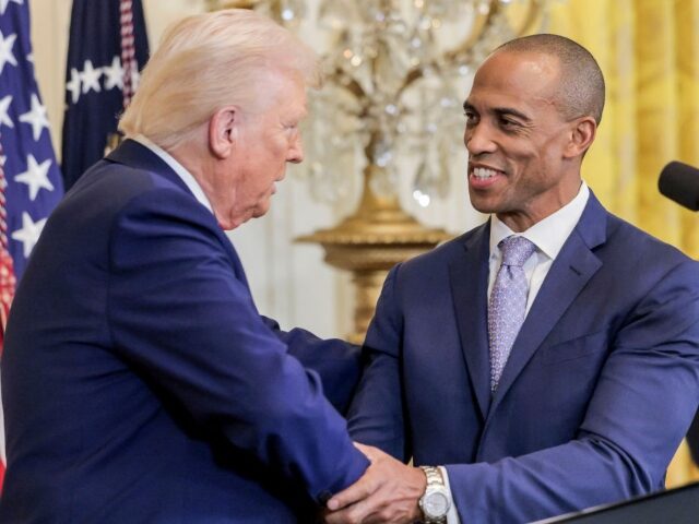 US President Donald Trump, left, and Eric Scott Turner, US secretary of Housing and Urban
