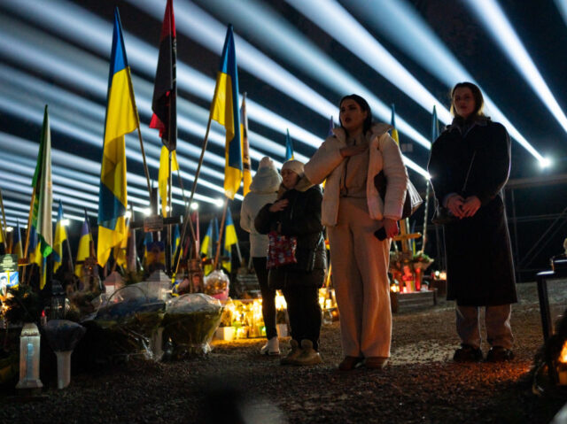 LVIV, UKRAINE - FEBRUARY 23: People gather at the Lychakiv cemetery during commemoration e