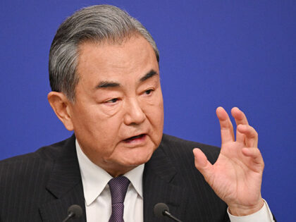 China's Foreign Minister Wang Yi speaks at a press conference during the ongoing National