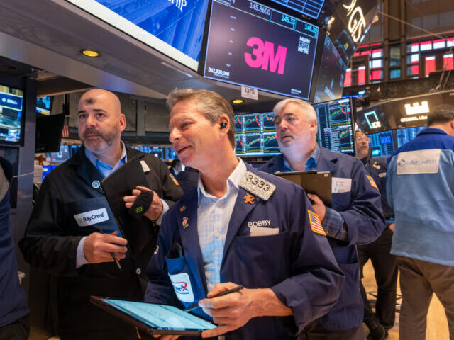 NEW YORK, NEW YORK—MARCH 05: Traders work on the floor of the New York Stock Exchange (N