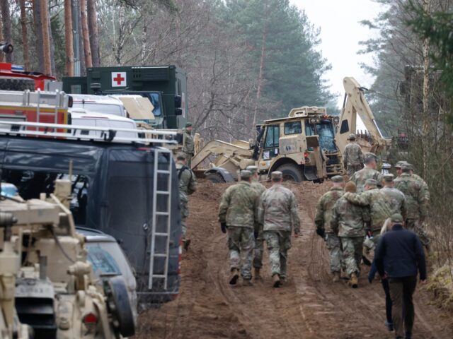 Military personnel work at the site of a rescue operation for missing US soldiers at Pabra
