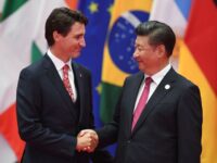 Canadian Prime Minister Justin Trudeau shakes hands with China's President Xi Jinping