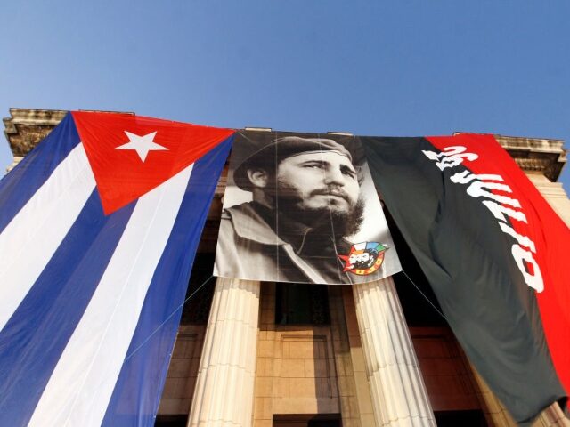 HAVANA, CUBA - NOVEMBER 26: Flags of Cuba an 26th July movement are seen during an act to