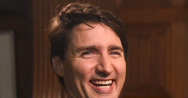 Photo: Justin Trudeau Sticks Out Tongue While Carrying His Chair out of Canada's Parliament