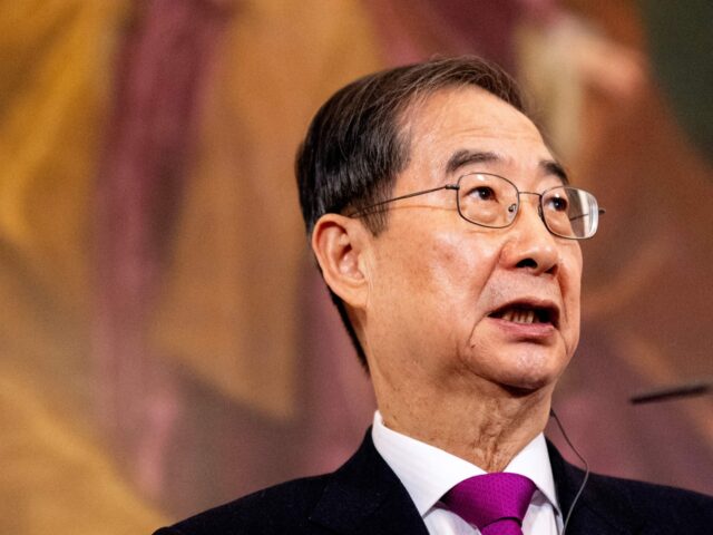 South Korea's Prime Minister Han Duck-soo gives a joint press conference with Austria's Ch