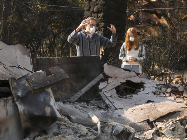 Home destroyed in Los Angeles wildfire ALTADENA, CA - JANUARY 10, 2025 - - An upset Mark Turner and his daughter May, 13, look ov