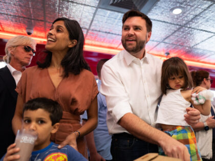 Republican vice presidential nominee U.S. Sen. J.D. Vance (R-OH) carries his daughter Mari