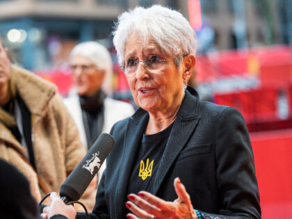 US singer-songwriter and activist Joan Baez speaks to journalists on the red carpet upon a