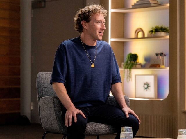 Mark Zuckerberg shows off his medallion