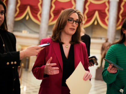 U.S. Rep. Sarah McBride (D-DE) speaks with the media while walking into the House Chambers