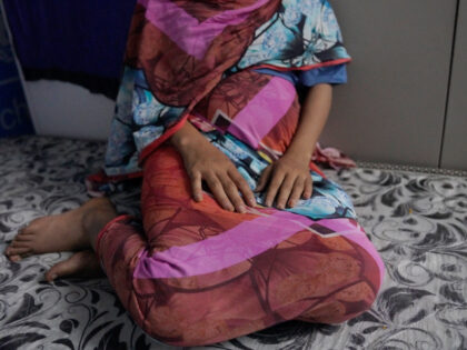 In this photograph released by UNICEF, a 16-year rape victim rests on a mattress at a UNIC