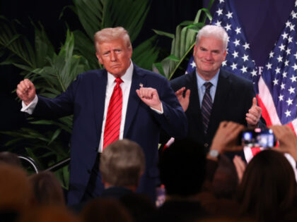 U.S. President Donald Trump dances as House Majority Whip Tom Emmer (R-MN) applauds follow