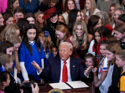 U.S. President Donald Trump joined by women athletes signs the “No Men in Women’s Spor