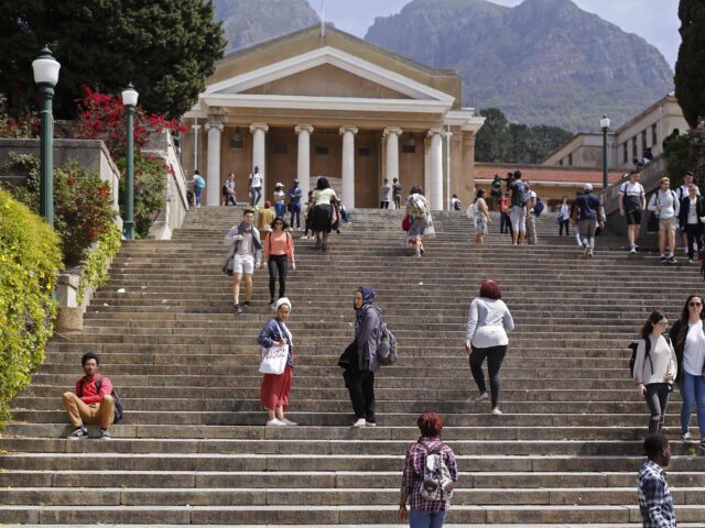 Students at the University of Cape Town campus interact as they return to class during cou