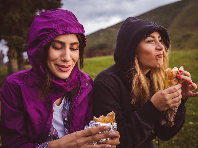 Young women enjoying a lunch they can't afford
