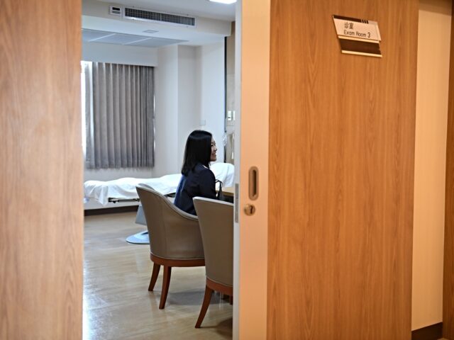 fertility china This photo taken on May 17, 2018 shows Chinese wife Xu Mengsha accompanied by husband Zhan