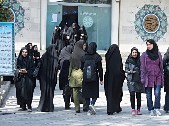 Female students walk across the campus of the University of Tehran, Iran, 18 October 2015.