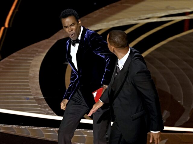 HOLLYWOOD, CALIFORNIA - MARCH 27: Will Smith appears to slap Chris Rock onstage during the