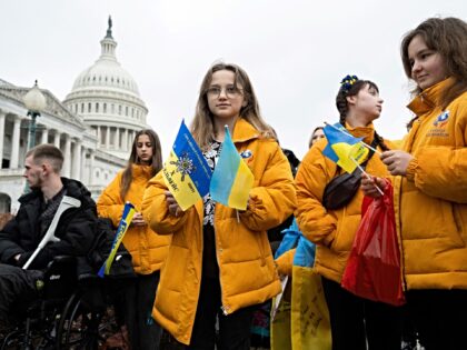 Ukrainian refugees and wounded Ukrainian soldiers attend a press conference by the Congres