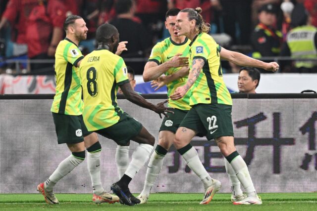 Australia's Jackson Irvine (right) celebrates with teammates after scoring against China i
