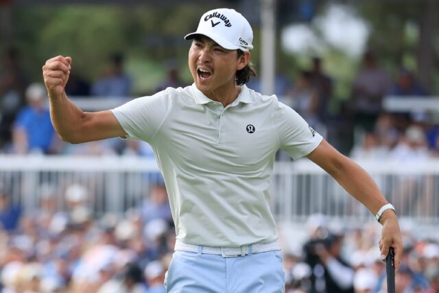 Australia's Min Woo Lee celebrates after tapping in a par putt on the 18th green at the Ho