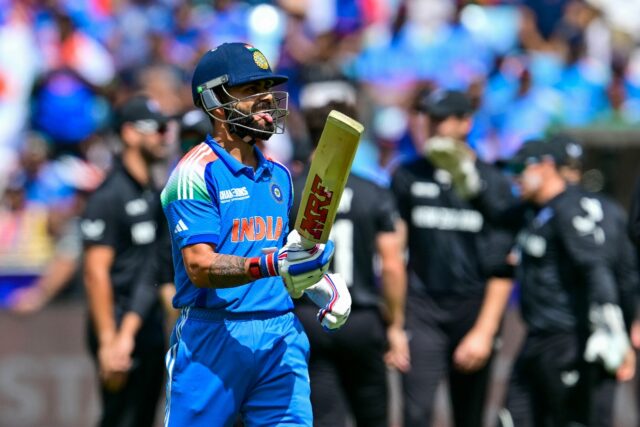 A baffled Virat Kohli leaves the crease after seeing New Zealand's Glenn Phillips produce