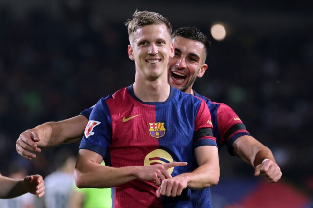 Barcelona's Spanish midfielder Daniel Olmo (front) celebrates with his teammate Ferran Tor