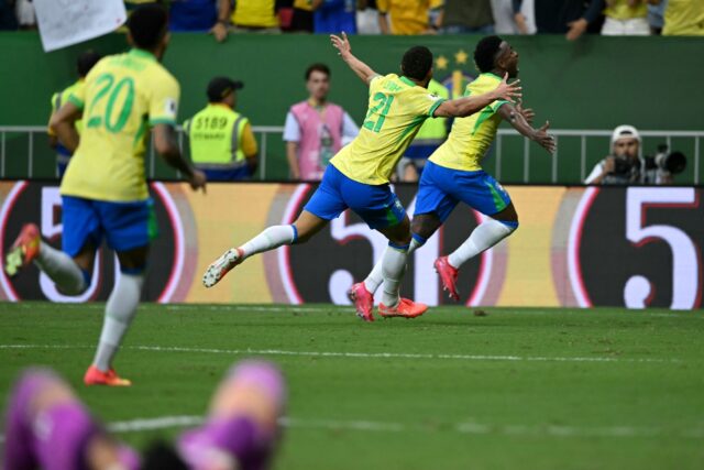 Brazil's Vinicius Jr (R) celebrates after scoring the winner against Colombia in World Cup