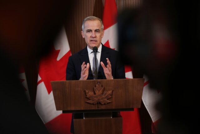 Canada's Prime Minister Mark Carney speaks to the media after meeting with his cabinet to