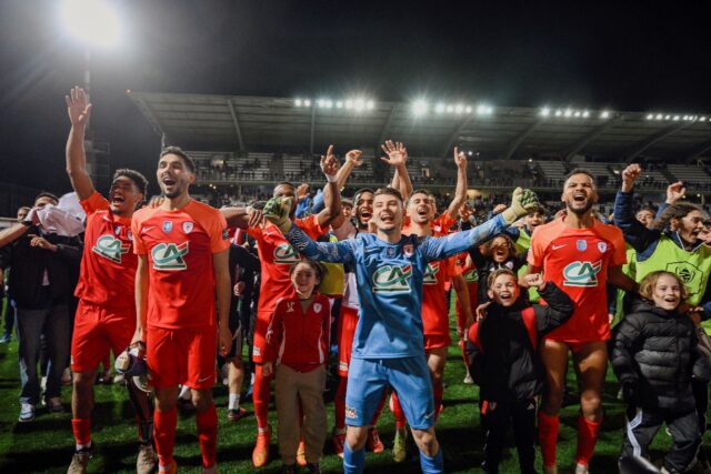 Cannes players celebrate after beating Guingamp in the French Cup quarter-finals in Februa