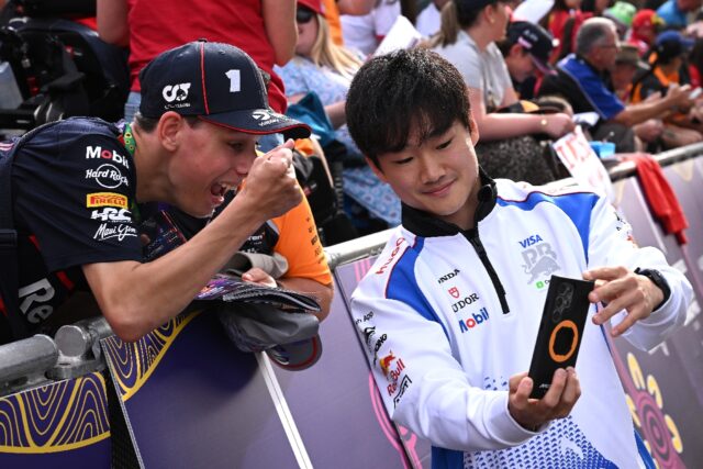 Man in demand: Yuki Tsunoda takes selfies with fans at the season-opening Australian Gran