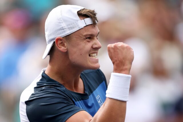Denmark's Holger Rune celebrates his upset win over Stefanos Tsitsipas in the fourth round
