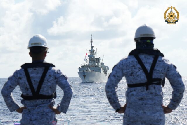 Filipino sailors watch a Canadian warship during joint maritime exercises in August 2024.