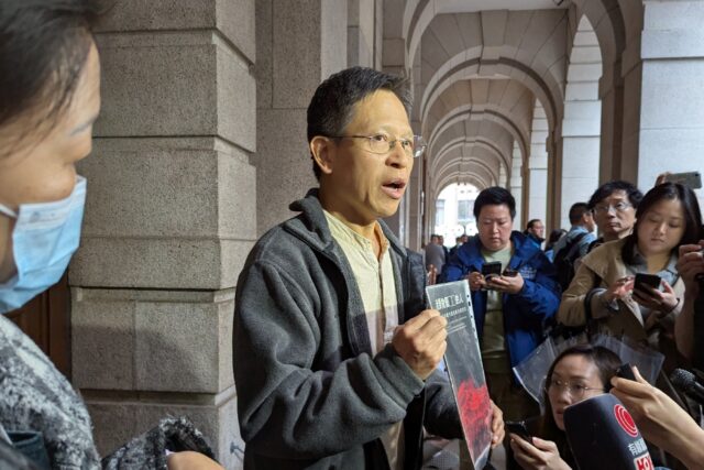 Hong Kong activist Tang Ngok-kwan (C) said the top court's ruling was a vindication of his