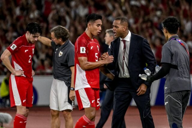 Indonesia's coach Patrick Kluivert (2R) celebrates their goal against Bahrain