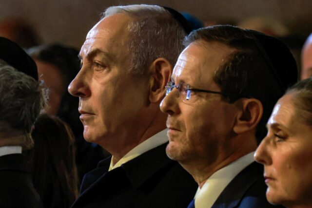 Israel's President Isaac Herzog and Prime Minister Benjamin Netanyahu attend a ceremony ma