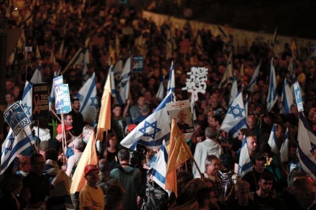 Israelis rally outside the parliament in Jerusalem on March 26, 2025, calling for an end t