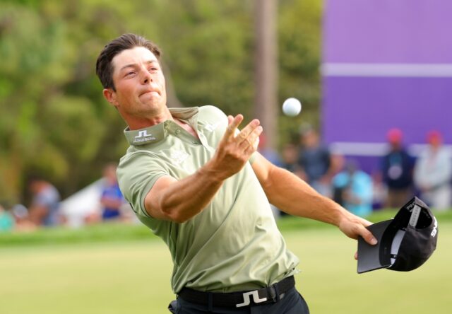 Norway's Viktor Hovland reacts on the 18th green after winning the PGA Tour Valspar Champi