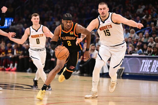 Oklahoma City Thunder's Shai Gilgeous-Alexander drives past Denver Nuggets star Nikola Jok