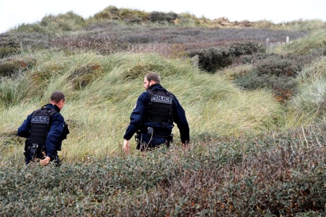 Police patrol Wimereux beach, northern France, in November 2021 after the drowning tragedy