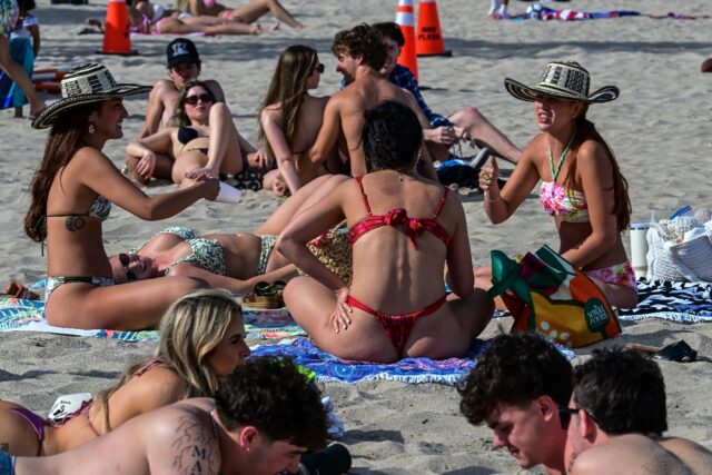 Revelers enjoy the beach on Las Olas Boulevard, Fort Lauderdale, Florida, during spring br