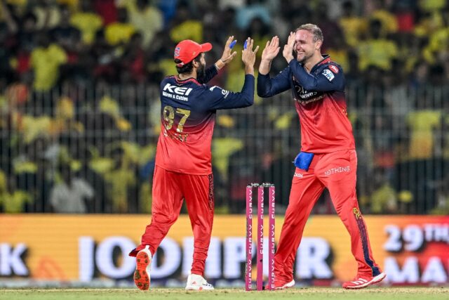 That's out: Royal Challengers Bengaluru's Liam Livingstone (R) celebrates with captain Raj