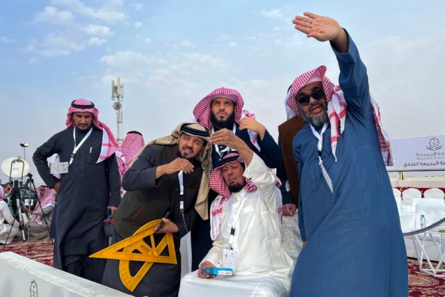 The Saudi moon-spotting team used a large yellow triangle and protractor to help work out